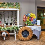 6ft timber candy cart, with treats and crisps wall on table for an engagement party