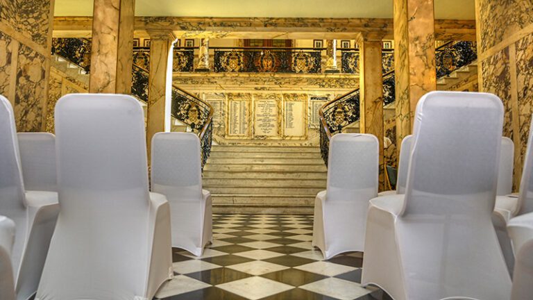 Minimalistic wedding ceremony décor at Stockport Town Hall with simple aisle styling, neutral tones, and elegant floral accents