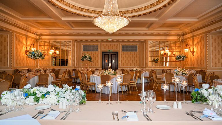 View from the bride and groom’s seats at the top table in the Goulburn Suite at Manchester Hall set for a wedding breakfast